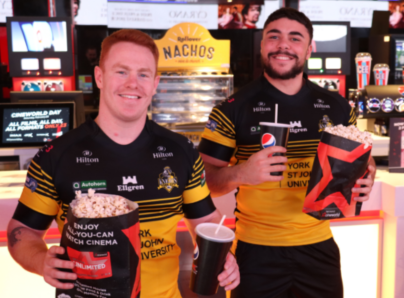 York City Knight Players with popcorn and drinks in the cinema
